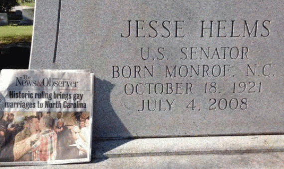 North Carolina Senator Jesse Helms' grave with a newspaper announcing that gay marriage has arrived in North Carolina. &nbsp;October, 2014