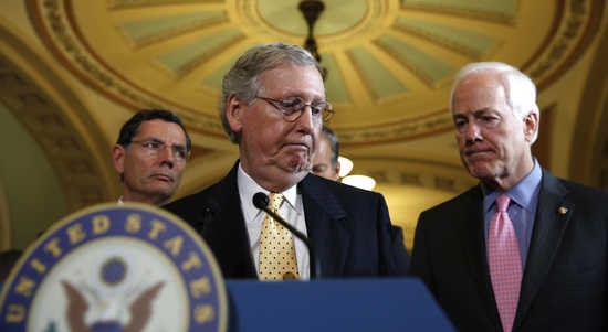 Senate Republican leader Mitch McConnell turns to Sen. John Cornyn, R-TX after speaking to reporters after the Republican party policy luncheon in the Capitol in Washington September 16, 2014. &nbsp;At left is Sen. John Barasso, R-WY. The U.S. House of Represe