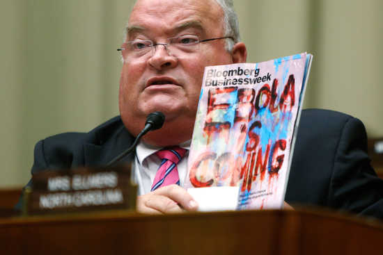 U.S. Representative Billy Long (R-MO) holds up a copy of a magazine with an Ebola headline as public health officials testify before a House Energy and Commerce Oversight and Investigations Subcommittee hearing on the U.S. response to the Ebola crisis, in Washington October 16, 2014. &nbsp;REUTERS/Jonathan Ernst &nbsp; &nbsp;(UNITED STATES - Tags: POLITICS HEALTH TPX IMAGES OF THE DAY) - RTR4AH7Z