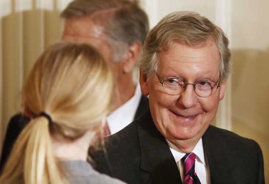 U.S.Sen. Mitch McConnell (R-KY) walks out after President Barack Obama announced the first five 