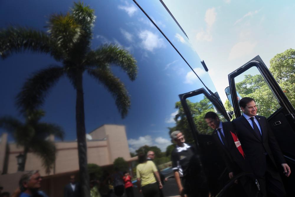 Marco Rubio steps off his campaign bus to attend an event in West Palm Beach.