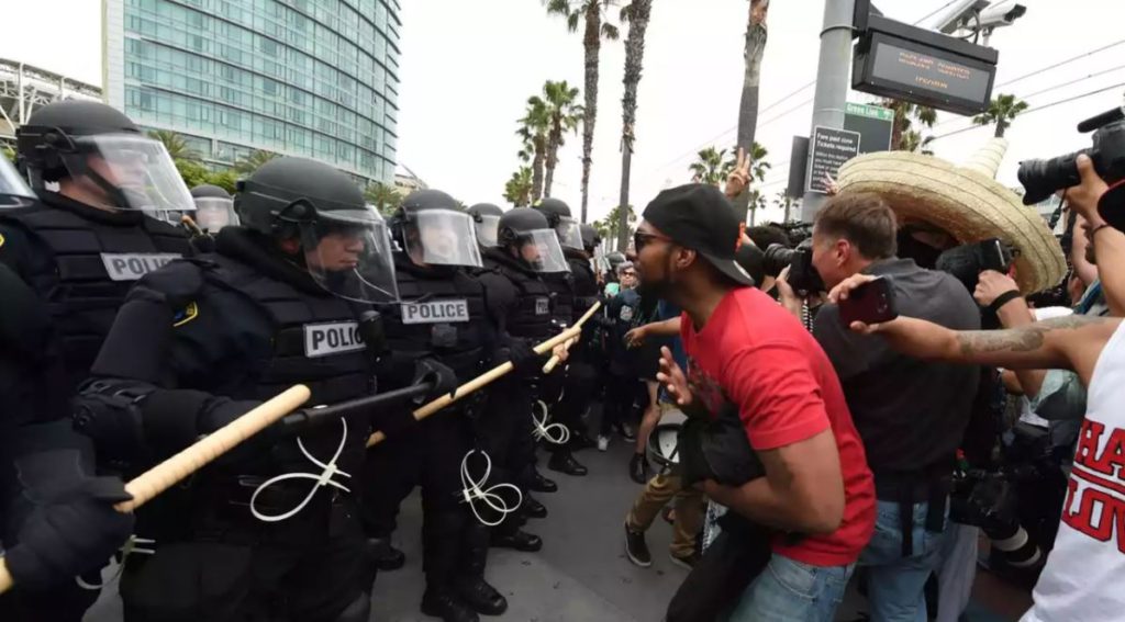 'Racists!' 'Illegals!' 'Scum!' protesters v Donald Trump supporters